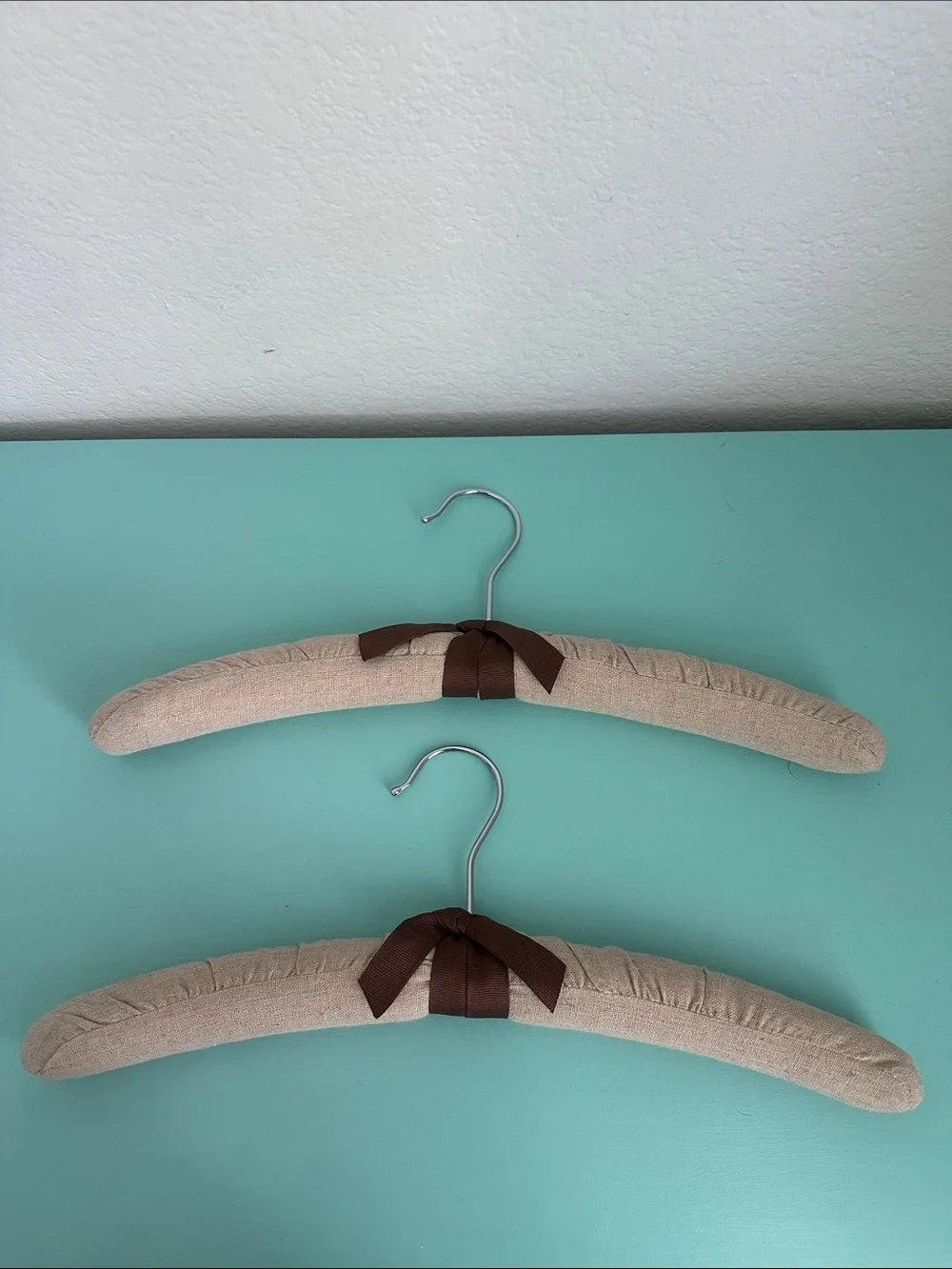 Linen padded heavy duty hangers set of 2ct.-beige color with a bow-brand new.